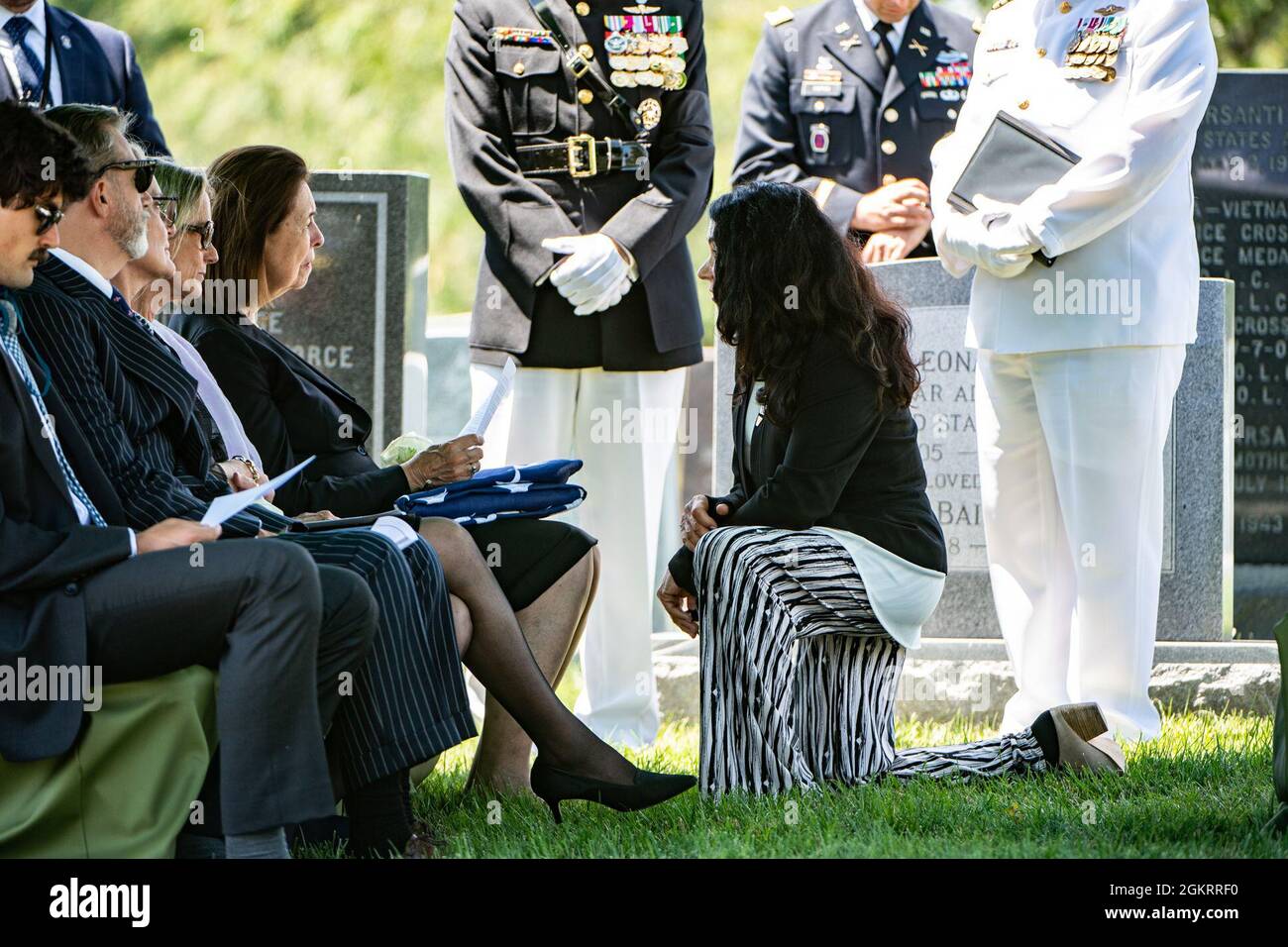 Karen Durham-Aguilera (right), executive director, Army National Military Cemeteries; gives condolences on behalf of Arlington National Cemetery to Jeanne Warner during the funeral service of Warner’s husband, U.S. Marine Corps 1st Lt. John Warner, in Section 4 of Arlington National Cemetery, Arlington, Virginia, June 23, 2021.    Former Senator for Virginia and former Secretary of the Navy, Warner was born on Feb. 18, 1927 in Washington, D.C. He joined the U.S. Navy at age 17 in 1945 and served during the final months of World War II. After graduating from the University of Virginia School of Stock Photo
