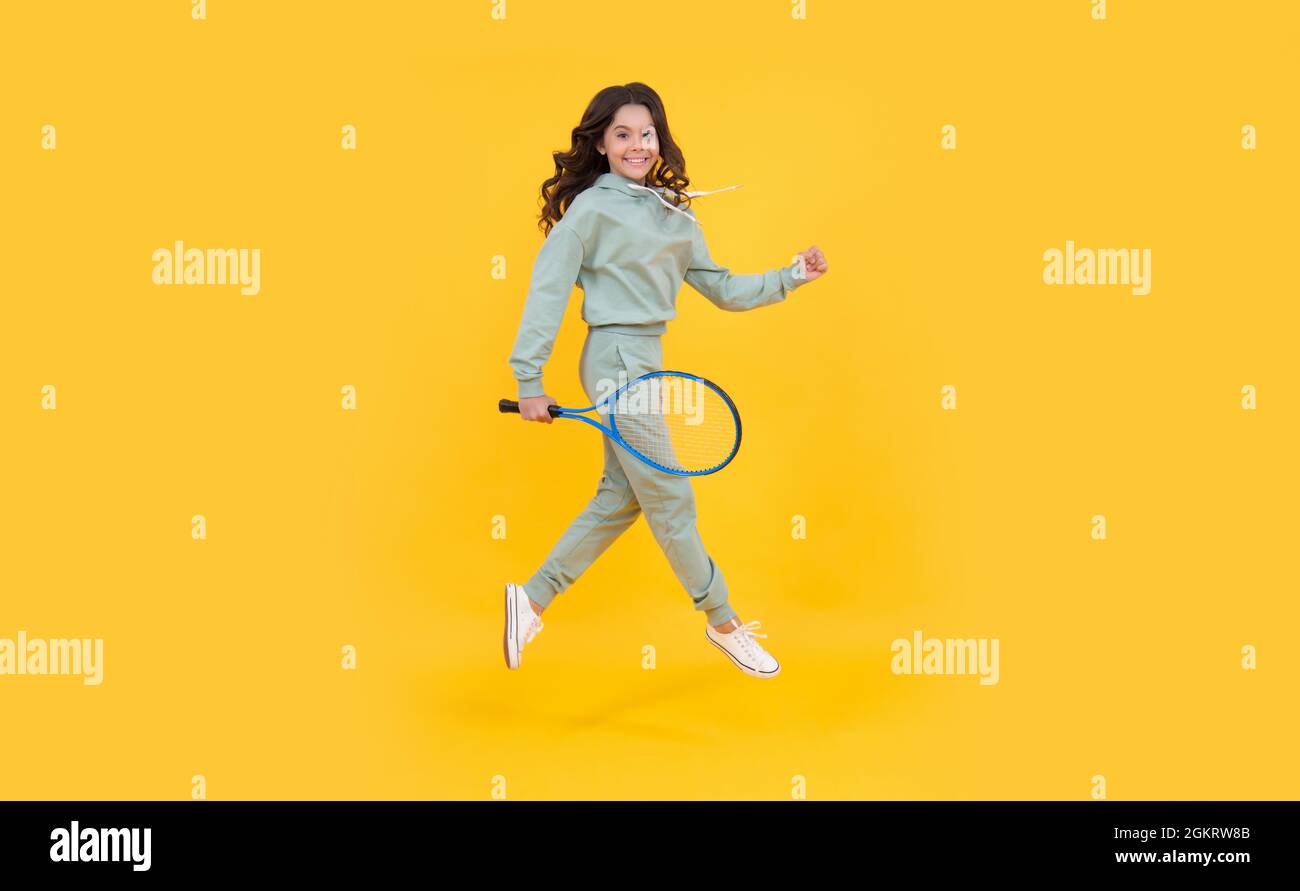 healthy and active lifestyle. sport success. happy childhood. kid jump with racket. Stock Photo