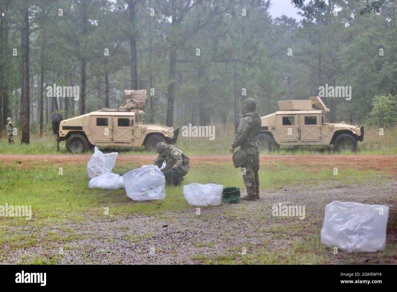 Army Reserve Soldiers from the 415th Chemical Brigade, set up a hasty decontamination site at a Fort Stewart training area on June 23 during a daytime mission as part of Exercise Rote Drache. The exercise brought together more than 1000 Army Reserve Soldiers from 16 states around the country to conduct two-weeks of Army Warrior Tasks and Military Occupational Speciality (MOS) training at Fort Stewart. (Official U.S. Army Reserve photo) Stock Photo