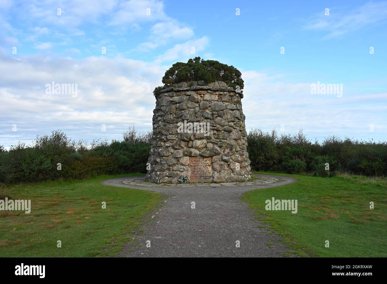 Circular stone monument at Culloden Moor, the site of a famous battle and a popular tourist attraction. Blue sky, clouds, no people. Stock Photo