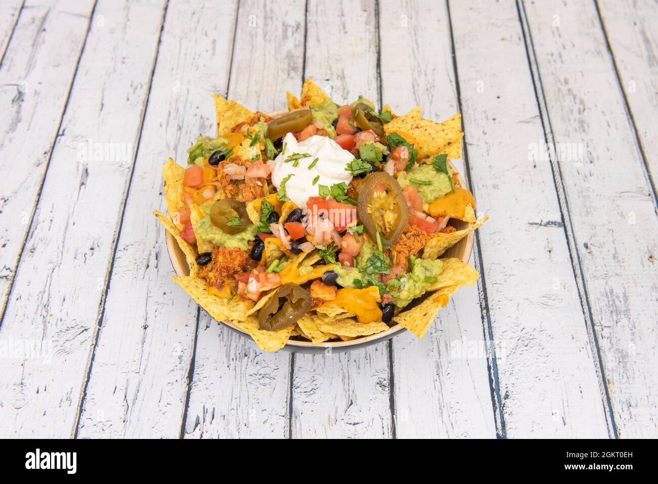 Mexican Corn Nachos with Shredded Chicken, Rabid Jalapeños, Cream