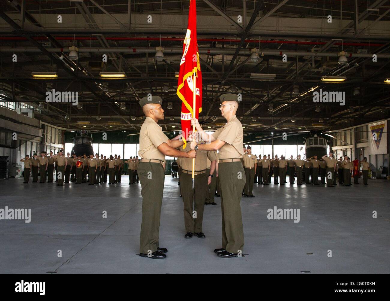 U.S. Marine Corps Lt. Col. John L. Roach (Right), Security Battalion’s commanding officer, passes the colors to Lt. Col. David S. Rainey during Security Battalion’s change of command ceremony at Marine Corps Base Quantico, Virginia. June 25, 2021. Lt. Col. John L. Roach relinquishes all duties and responsibilities to Lt. Col. David S. Rainey.  Roach has been with Security Battalion since June 2019. Stock Photo