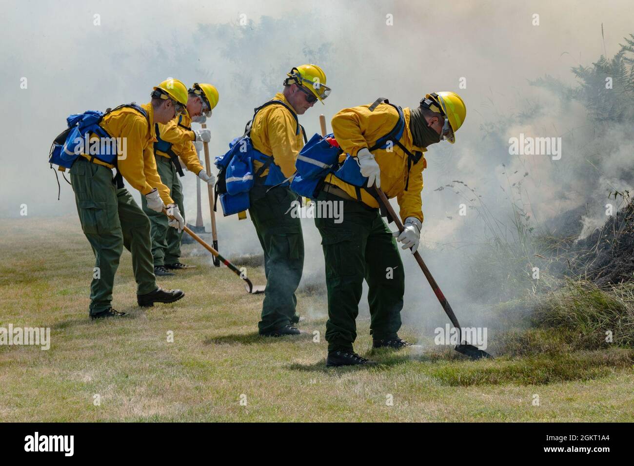 Oregon National Guard Citizen-Soldiers and Airmen use hand tools along ...