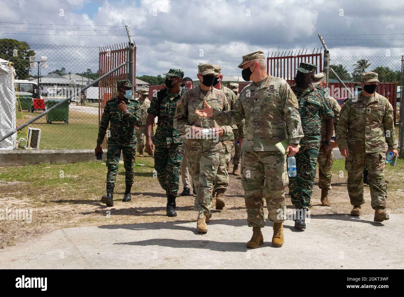 Maj. Gen. Rafael A. Ribas, deputy commander for mobilization and reserve affairs, U.S. Southern Command, receives a tour from Lt. Col. Timothy Starke, commander of 75th Troop Command, Kentucky National Guard during Tradewinds 21 at Camp Stephenson, Guyana, June 24, 2021. Tradewinds 21 is a U.S. Southern Command (SOUTHCOM) sponsored Caribbean security-focused exercise in the ground, air, sea, and cyber domains; working with partner nations to conduct joint, combined, and interagency training, focused on increasing regional cooperation and stability. Stock Photo