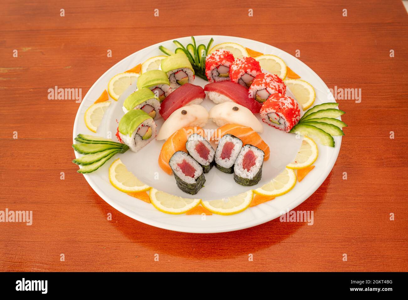 Assorted sushi tray with bluefin tuna maki, surimi uramaki with avocado
