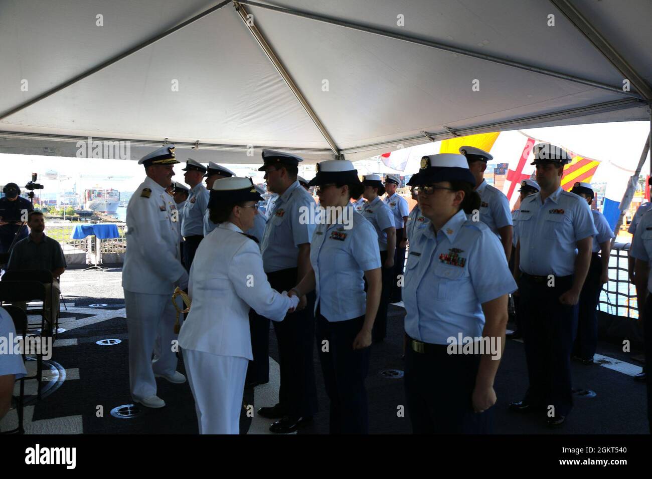 Capt. Mary Ellen J. Durley and Capt. Kenneth J. Boda conduct a personnel inspection during the Coast Guard Cutter Healy’s (WAGB 20) change of command ceremony aboard the cutter moored at Base Seattle, June 25, 2021. Boda relieved as Durley Healy’s commanding officer during the ceremony. Boda relieved Durley as Healy’s commanding officer during the ceremony. Stock Photo