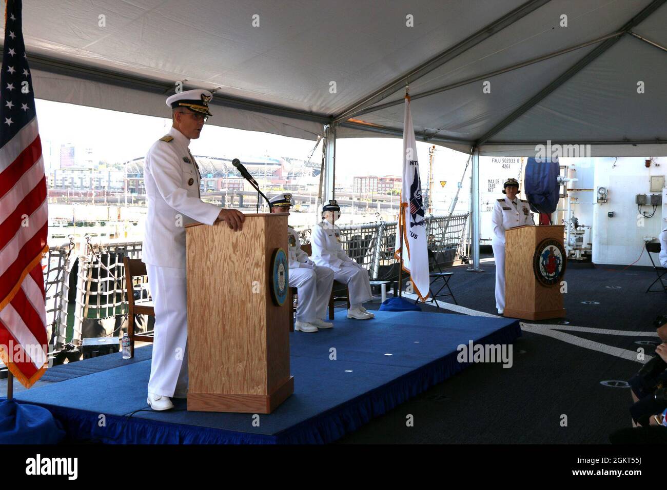 Coast Guard Rear Adm. Peter W. Gautier, acting commander, U.S. Coast Guard Pacific Area and Defense Forces West, speaks during the Coast Guard Cutter Healy (WAGB 20) change of command ceremony aboard the cutter moored at Base Seattle. Capt. Kenneth J. Boda relieved Capt. Mary Ellen J. Durley as Healy’s commanding officer during the ceremony. Stock Photo