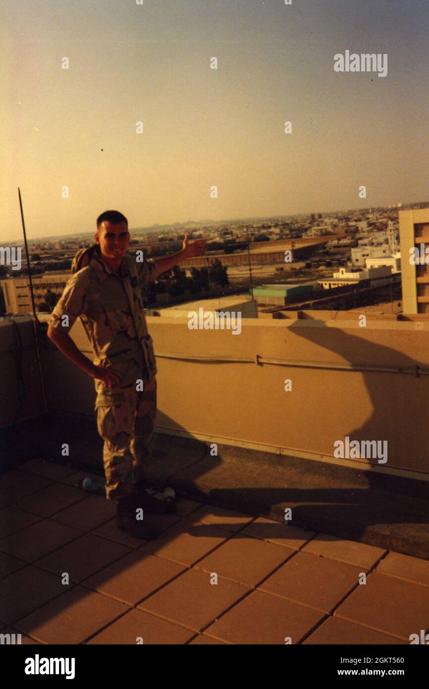 Then-Senior Airman Clifton Fulkerson poses on top of Building 131 of the Khobar Towers complex in Saudi Arabia, one week prior to terrorists detonating a truck bomb killing 19 US Air Force Airmen and wounding hundreds more. Stock Photo