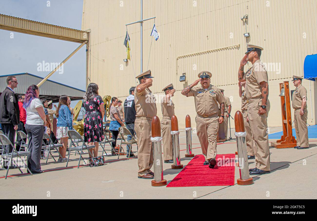 210625-N-NT795-341 IMPERIAL BEACH, Calif. (June 26, 2021) Chief Gunner’s Mate Jeff “JP” Palma, safety officer assigned to Maritime Expeditionary Security Group (MESG) 1, walks through ceremonial side boys during his retirement ceremony onboard Naval Outlying Landing Field Imperial Beach, Calif., June 25. Palma retired after 24 years of naval service. The primary mission of MESF is to conduct maritime security operations across all phases of military operations by defending high value assets, critical maritime infrastructure, ports, and harbors both inland and on coastal waterways against enemi Stock Photo