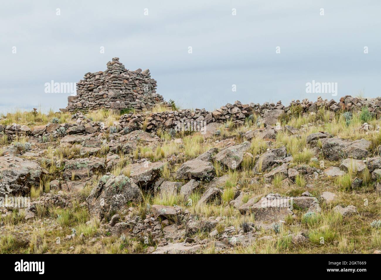 Stone wall of a temple on Pachatata hill on Amantani island in Titicaca lake, Peru Stock Photo