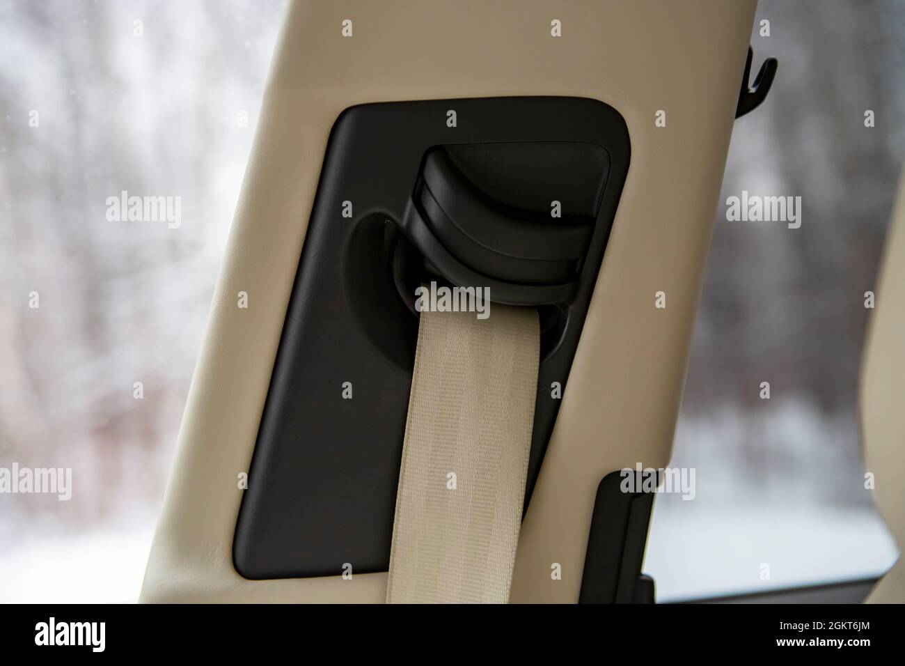 close up side pillar with a light-colored seat belt in a modern car Stock Photo