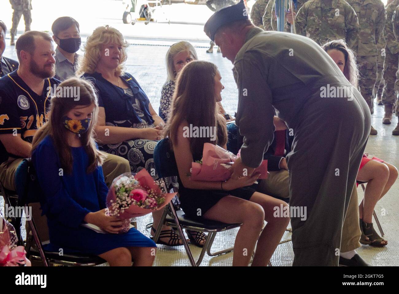 Col. John Gonzales, 51st Fighter Wing outbound commander, hands his
