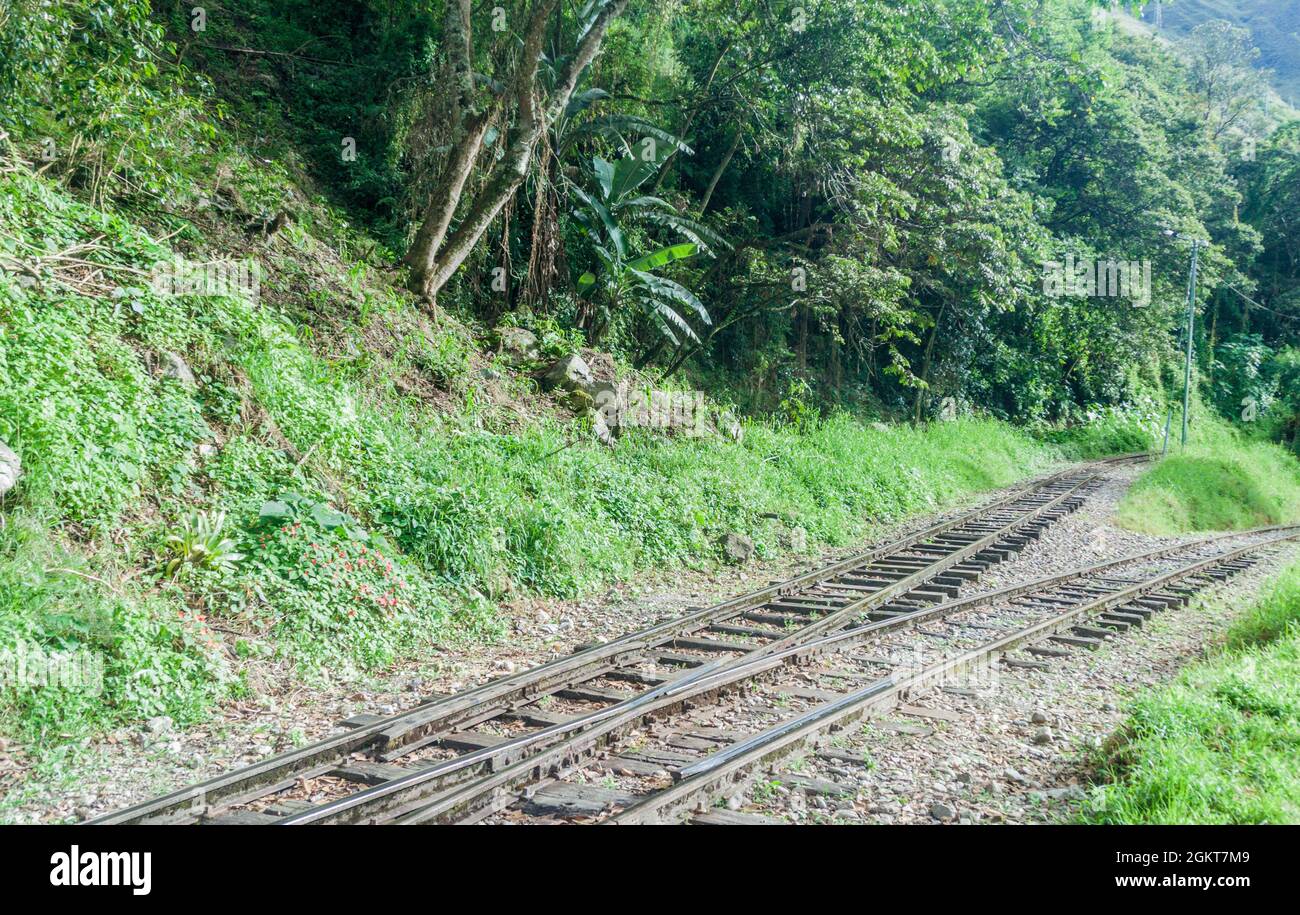 Railway track in Urubamba river valley near Aguas Calientes village, Peru Stock Photo