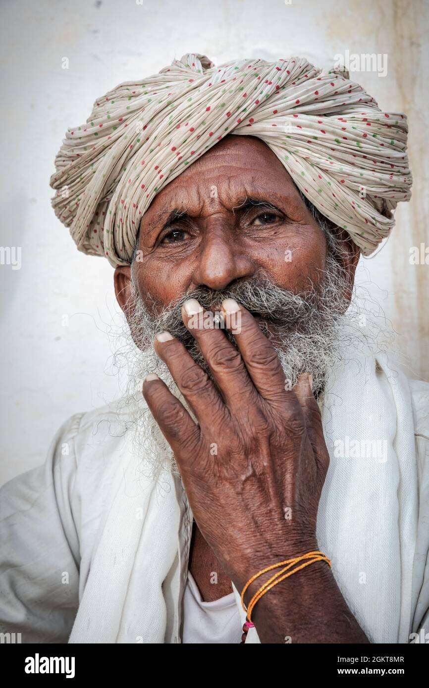 Portrait of an elderly Indian man smoking, Jaisalmer, Rajasthan, India Stock Photo