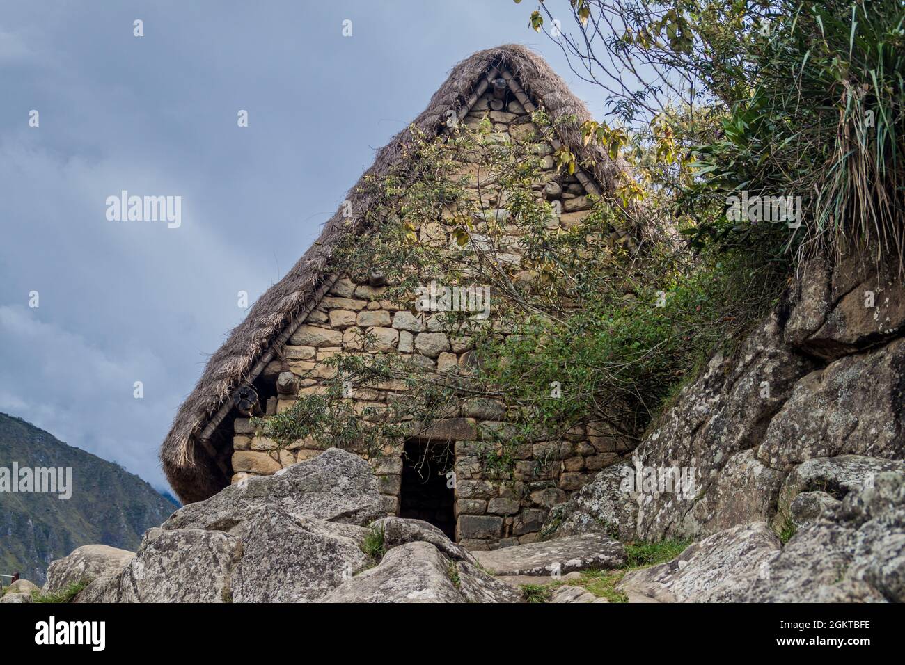 House near ceremonial rock at Machu Picchu ruins, Peru Stock Photo - Alamy