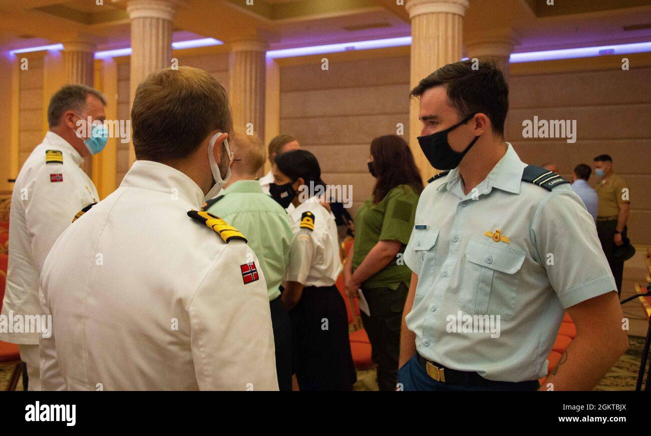 210628-F-D0094-0006 ODESA, Ukraine (June 28, 2021) Captain Alexander Lavoie, a Canadian Armed Forces (CAF) Staff Officer Mentor, speaks with a senior officer from the Royal Norwegian Navy during the opening ceremony of Exercise SEA BREEZE 21 in Odesa, Ukraine on June 28, 2021. Co-hosted by the United States Navy Stock Photo