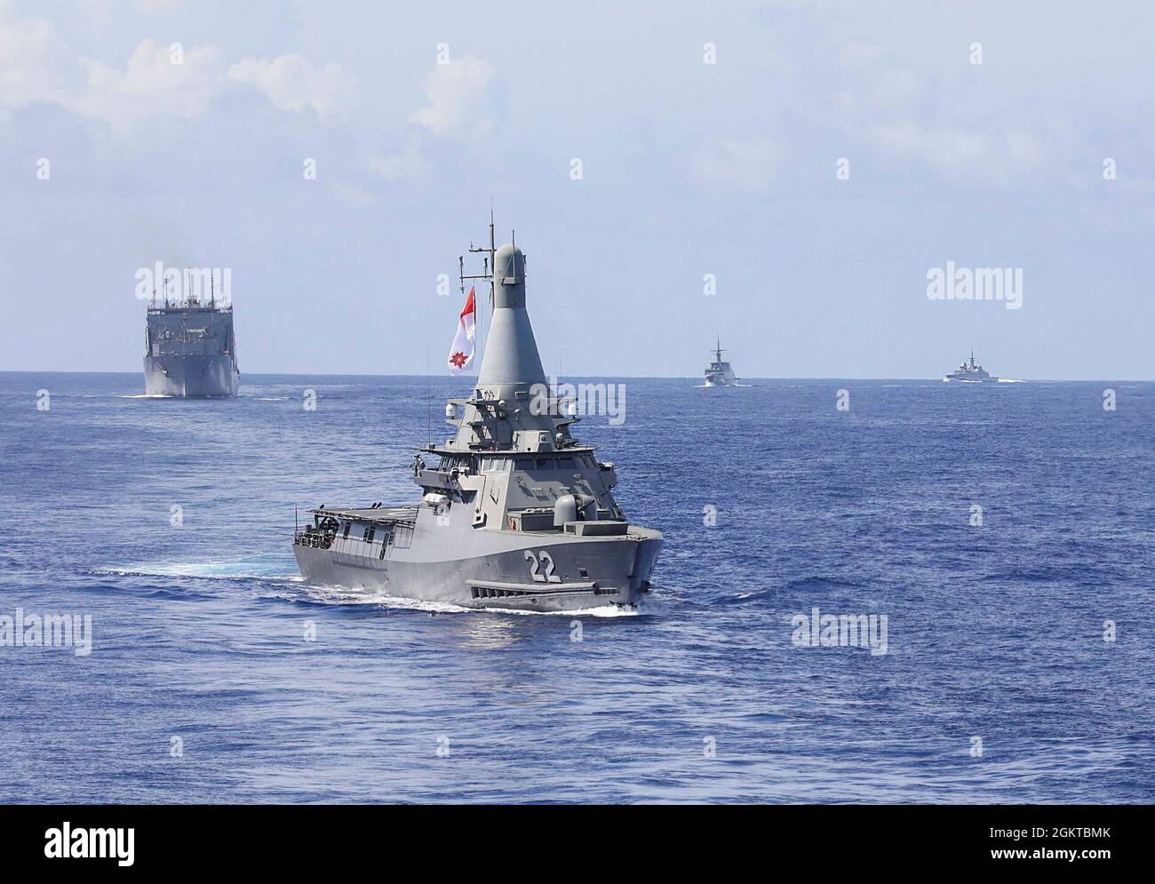 The Republic of Singapore Independence-class littoral mission vessel RSS Fearless (LMV 22) sails in formation with Lewis and Clark class dry cargo and ammunition ship USNS Amelia Earhart (T-AKE 6), and Republic of Singapore Formidable-class frigates RSS Tenacious (FFC 71) and RSS Stalwart (FFC 72), for a photo exercise (PHOTOEX) during Pacific Griffin 2021. Pacific Griffin is considered the most complex and warfare-centric bilateral engagement between both navies and represents a continued investment in the strengthening of the solid partnership between the U.S. and Republic of Singapore. Stock Photo