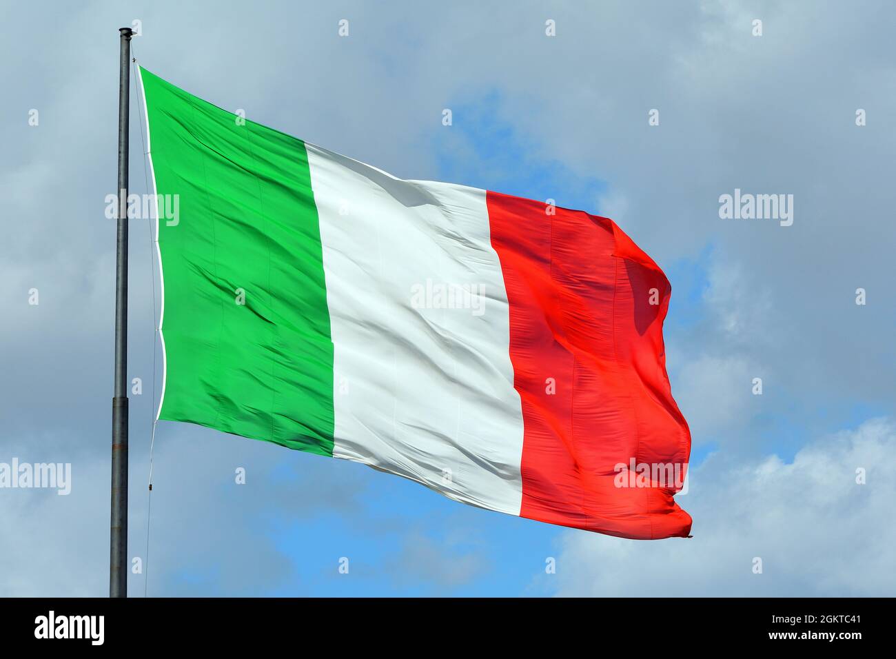 Italian national flag before the Railway station in Florence - Italy. Stock Photo