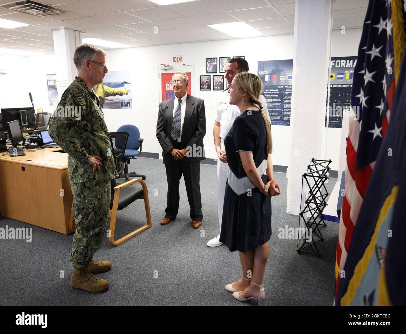 Rear Adm. Tim Weber, commander, Naval Medical Forces Pacific and director of the Navy’s Medical Service Corps (MSC), talks with Haley Barravecchia and her family before her commissioning ceremony at the Navy Talent Acquisition Group New England offices in Boston, June 28. Weber commissioned Barravecchia, who received her graduate degree in public health from Harvard University, into the U.S. Navy as an MSC officer. She will serve as an environmental health officer, protecting Sailors and Marines from diseases and other public health threats. Stock Photo