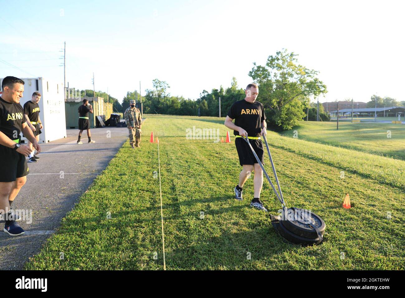 Col. Joseph Kurz, chief of staff, 1st Theater Sustainment Command, back  peddles his feet while pulling a 90-pound sled, 25 meters down-and-back, as  part of an Army Combat Fitness Test assessment on