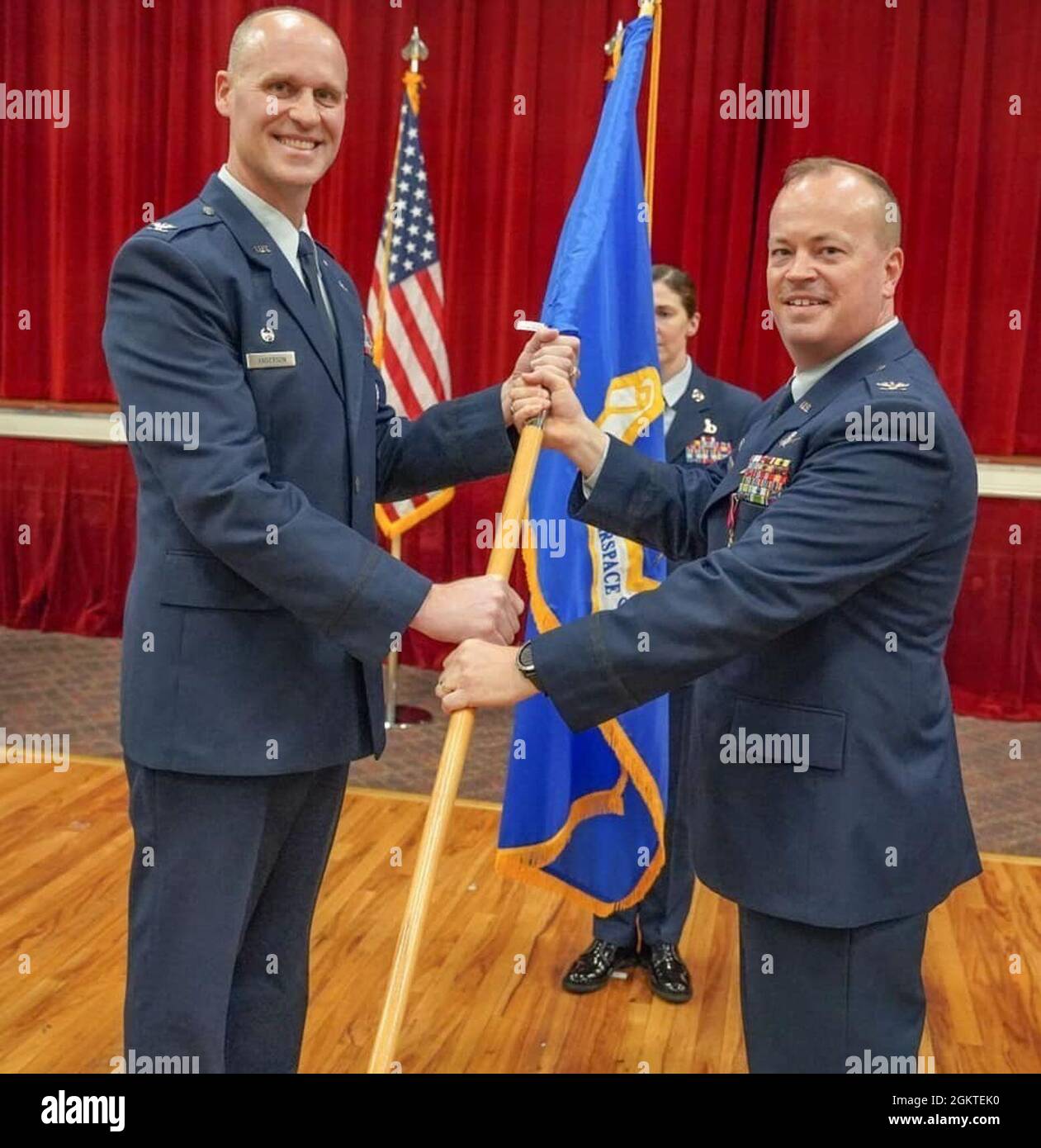 Col. Kevin Kirsch relinquishes the Group flag to Col. Steven Anderson, 688th Cyberspace Commander during the 690th Cyberspace Operations Group Commander and 688th Cyberspace Wing A2/A3 Director Change of Command Ceremony June 29, 2021 at Arnold Hall, Joint Base San Antonio-Lackland, Texas. Col. Kevin Kirsch transferred command to Col. Billy Pope. Stock Photo