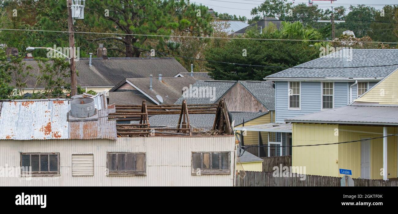 NEW ORLEANS, LA, USA - SEPTEMBER 28, 2021:  Portion of   frame exposed after Hurricane Ida blew off corrugated metal roof in Uptown Neighborhood Stock Photo