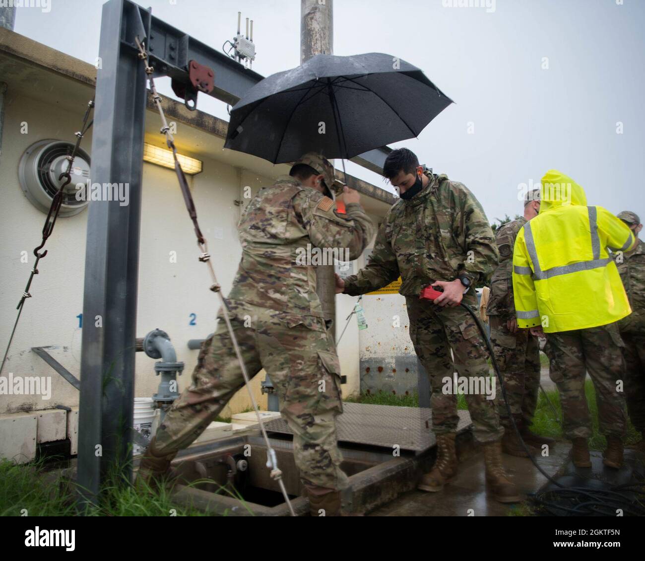 Airmen from the 18th Civil Engineer Squadron Water and Fuel Systems Maintenance shop supplement an overtaxed sewage system by evacuating the excess water into a mobile system on Kadena Air Base, Japan, June 29, 2021. A WFSM technician’s duties range from treating water to ensure it's safe to drink, to maintaining the aircraft’s fueling systems that keep jets in the air. Stock Photo