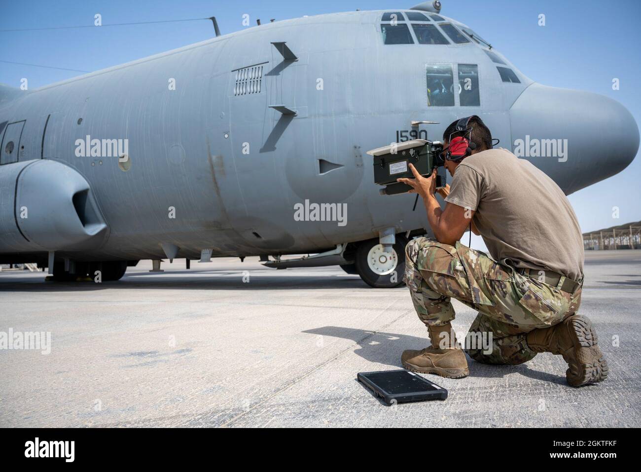 U.s. Air Force Airman 1St Class Gabriel Castro, 380Th Expeditionary Aircraft  Maintenance Squadron, Verifies That The Mode 5 Identification Friend Or Foe  (Iff) Antenna Is Working Properly On An Ec-130 Compass Call