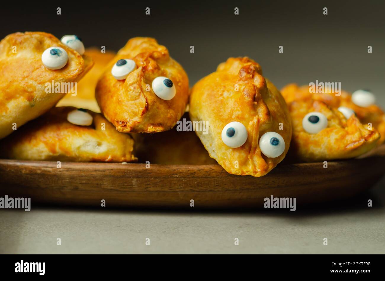 Mini pasties with decorating eyes, succulent pork, turkey, bacon and  cranberry all wrapped in shortcrust pastry, funny food Stock Photo - Alamy