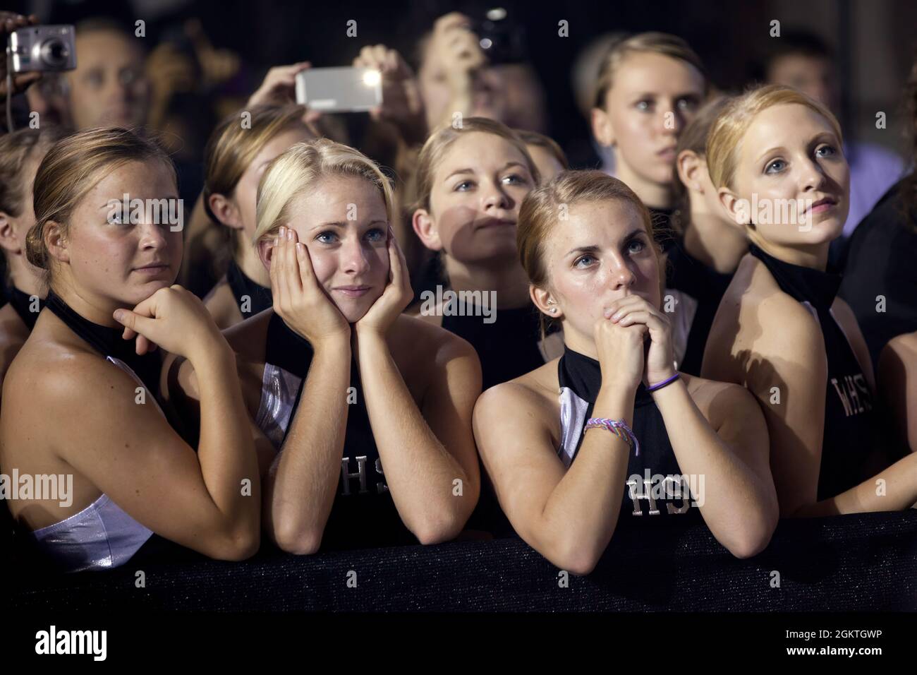 Oct. 17, 2011'A group of high school cheerleaders listen in rapt attention as the President delivered remarks on the American Jobs Act at West Wilkes High School in Millers Creek, N.C.'  (Official White House Photo by Pete Souza)  This official White House photograph is being made available only for publication by news organizations and/or for personal use printing by the subject(s) of the photograph. The photograph may not be manipulated in any way and may not be used in commercial or political materials, advertisements, emails, products, promotions that in any way suggests approval or endors Stock Photo