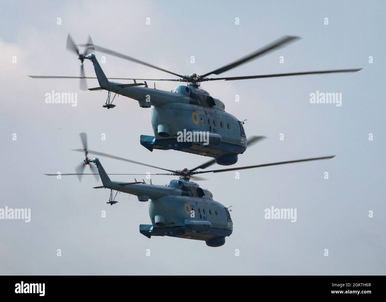 210630-N-BM428-0247 MYKOLAIV MILITARY AIRBASE, Ukraine (June 30, 2021) Two Ukrainian Mi-8 helicopters fly in formation during an air demonstration portion of Exercise Sea Breeze 2021 on Mykolaiv Military Airbase, Ukraine, June 30, 2021. Exercise Sea Breeze is a multinational maritime exercise cohosted by the U.S. Sixth Fleet and the Ukrainian Navy since 1997. Sea Breeze 2021 is designed to enhance interoperability of participating nations and strengthens maritime security and peace in the region. Stock Photo