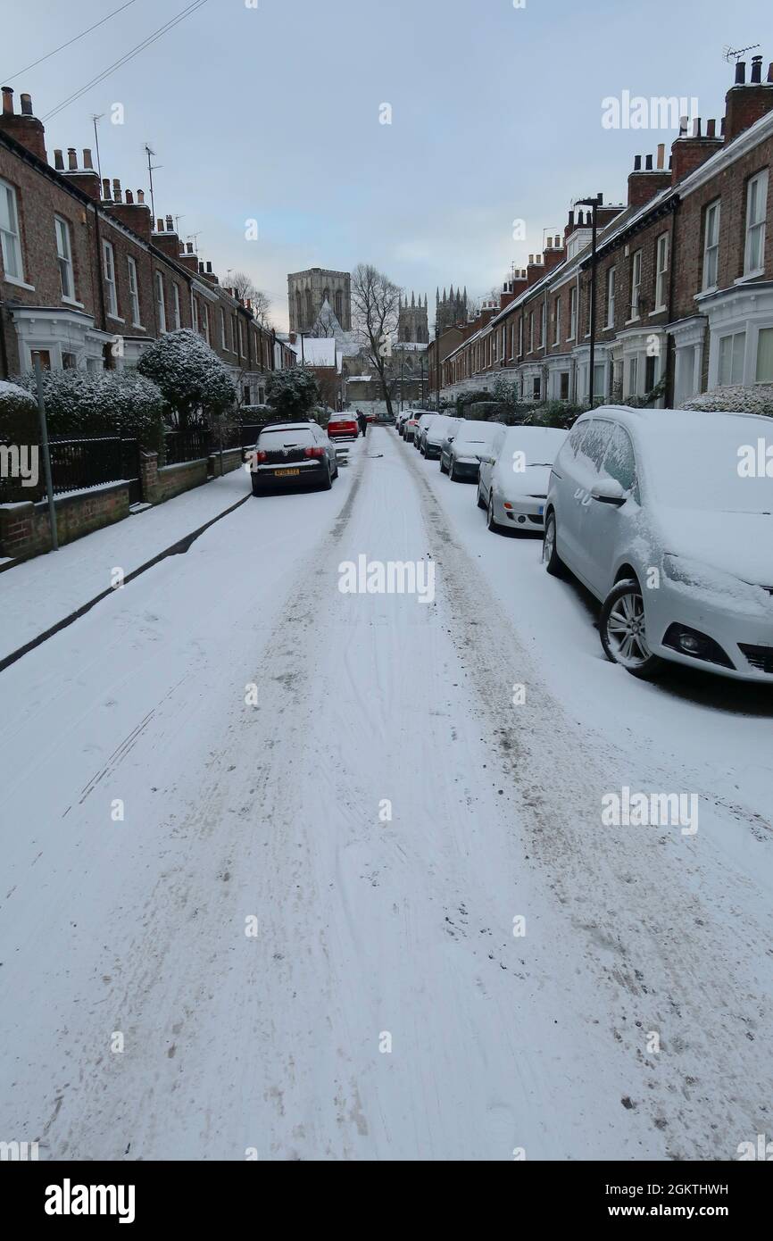 Cars in street covered in snow, York, UK Stock Photo