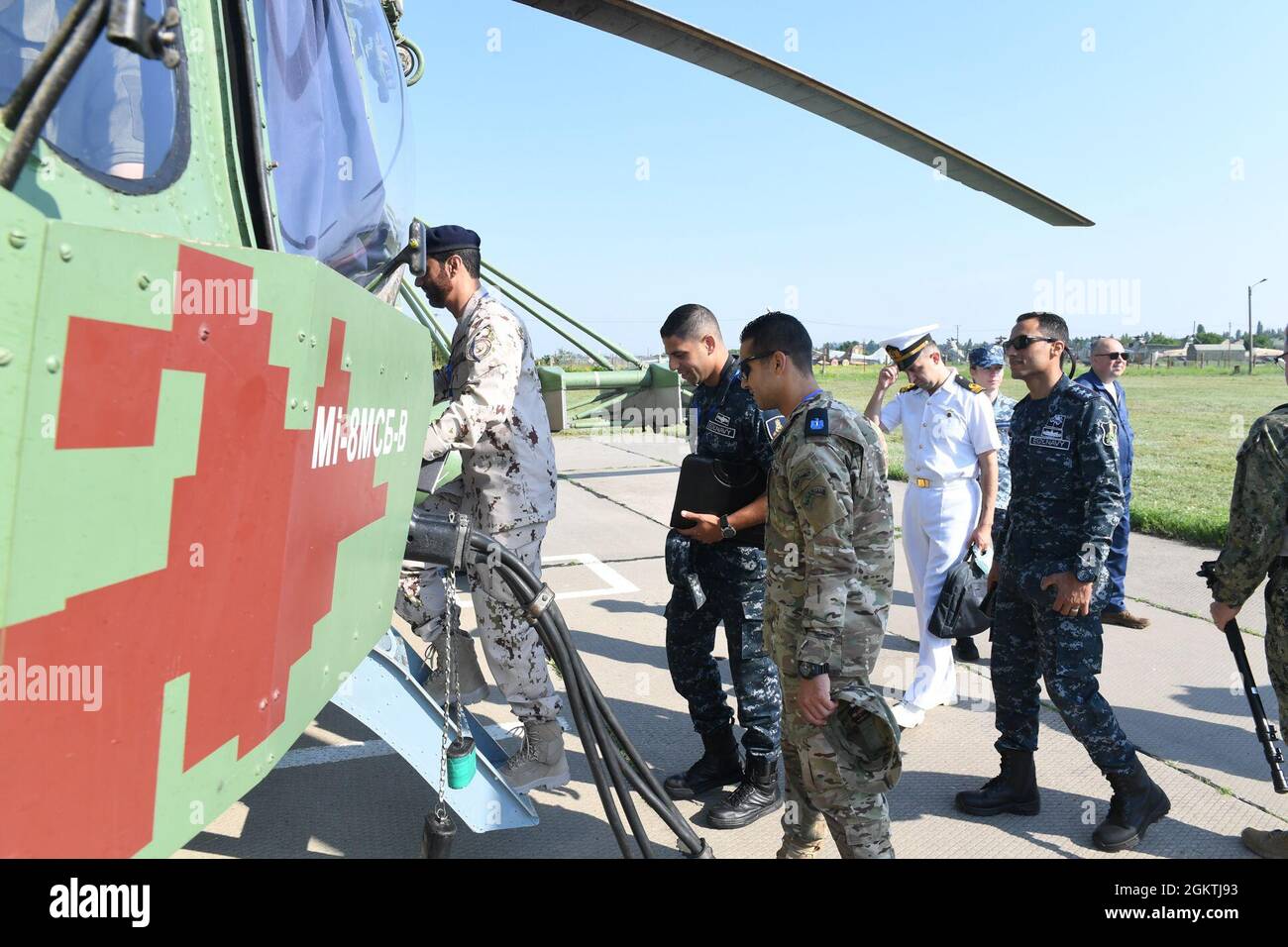 210630-N-VP310-0025  ODESA, Ukraine (June 30, 2021) Egyptian, United Arab Emirates, Canadian and Turkish military officers board a Ukrainian Mi-8 Helicopter to attend an air demonstration for Exercise Sea Breeze 2021 Odesa, Ukraine, June 30, 2021. Exercise Sea Breeze is a multinational maritime exercise cohosted by the U.S. Sixth Fleet and the Ukrainian Navy since 1997. Sea Breeze 2021 is designed to enhance interoperability of participating nations and strengthens maritime security and peace in the region. Stock Photo