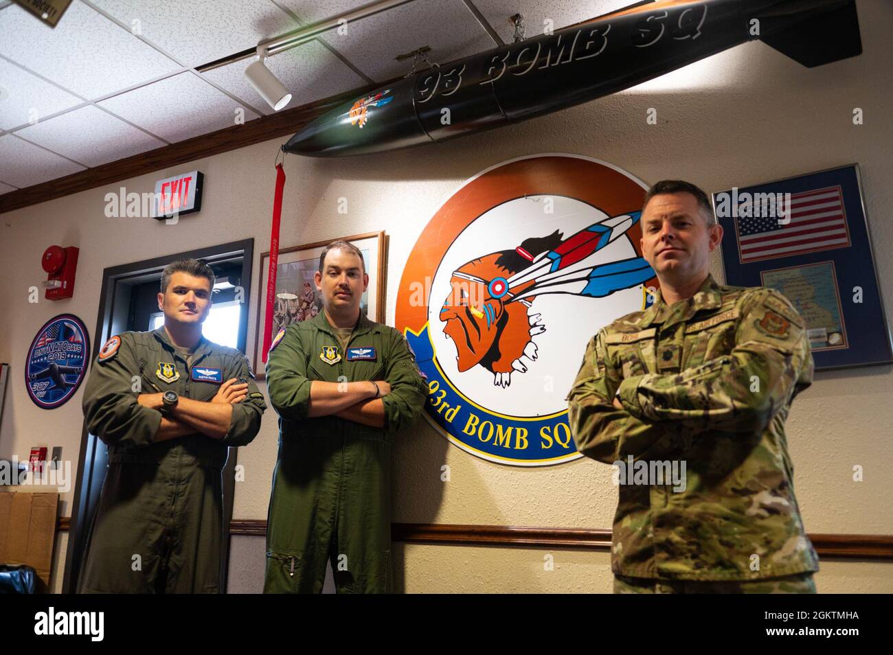 U.S. Air Force Maj. Austin Fouts, 93rd Bomb Squadron B-52 instructor pilot, Maj. Christopher Cousler, 93rd BS electronic warfare officer, and Lt. Col. Aaron Bohl, 307th Operational Support Squadron Director of Operations stand in front of the 93rd Bomb Squadron logo in the squadron heritage room at Barksdale Air Force Base, Louisiana, June 30, 2021. These officers are scheduled to compete on the 93rd Bomb Squadron team in the world’s premiere bomber competition, the Air Force Global Strike Challenge 2021. Stock Photo