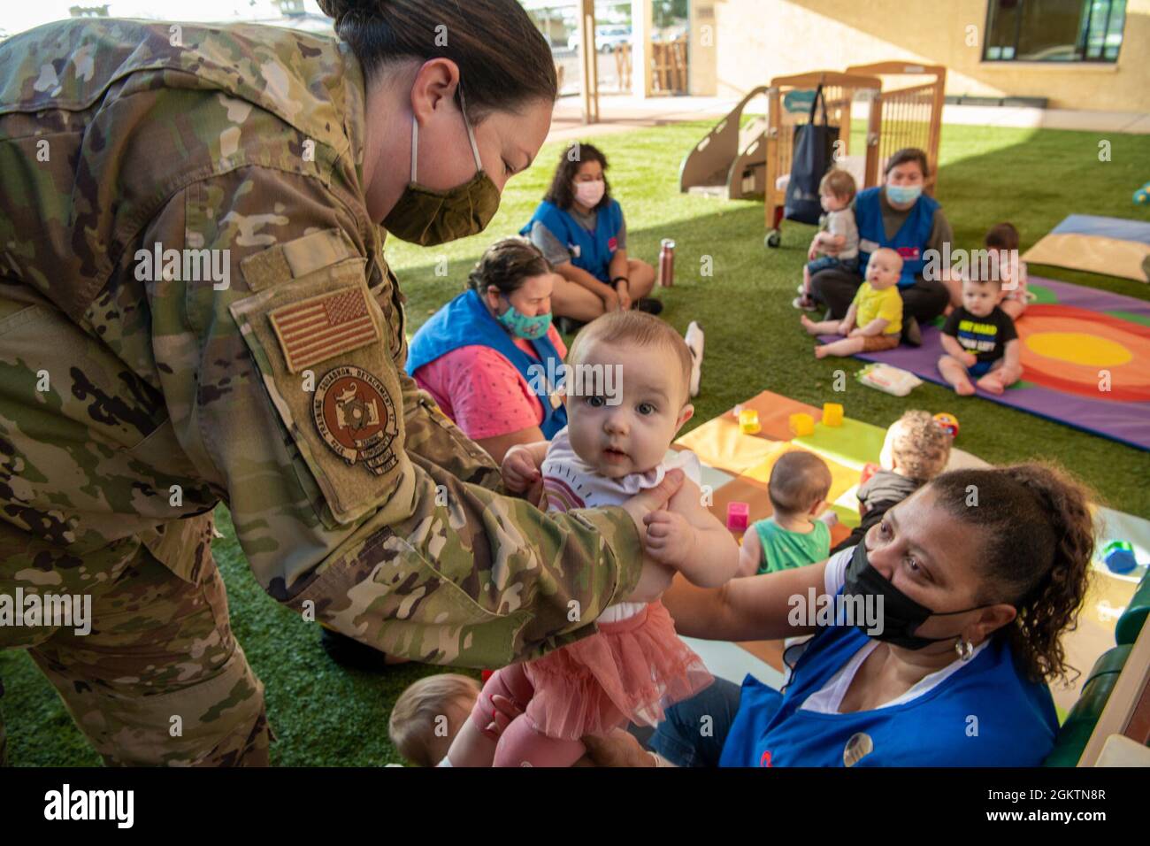 A service member drops off her daughter to Cassandra Oakley, 56th Force  Support Squadron Child Development Center caregiver, June 30, 2021, at Luke Air  Force Base, Arizona. The Luke AFB CDC is