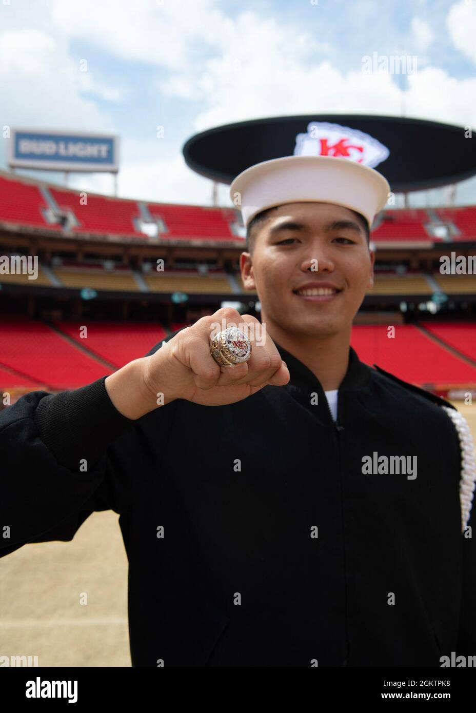 Aviation Structural Mechanic 3rd Class Ken Sachio Boctot, assigned to U.S. Navy Ceremonial Guard “Drill Team Platoon”, poses for a photo with a Kansas City Chiefs Super Bowl ring during a tour of Government Employees Health Association Field at Arrowhead Stadium in Kansas City, Missouri July 1, 2021. GEHA Field at Arrowhead Stadium is home to the Kansas City Chiefs NFL team. The event was part of Kansas City Navy Week, the first in-person Navy Week since the beginning of the COVID-19 pandemic, bringing Sailors from different Navy units across the U.S. to conduct focused outreach with members o Stock Photo