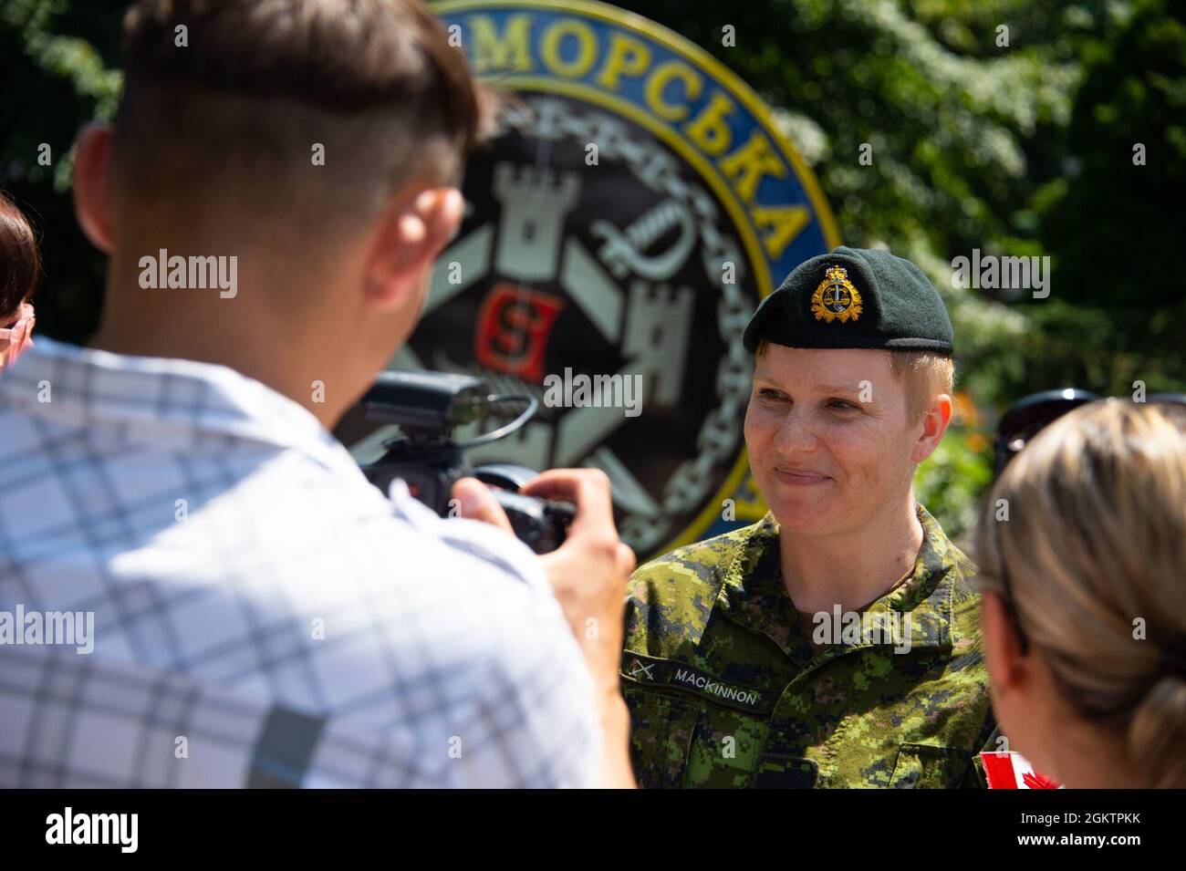 210701-F-D0094-0010 ODESA, Ukraine (July 1, 2021) Major Emily MacKinnon, a Legal Advisor from the Canadian Armed Forces (CAF), responds to interview questions by the Ukrainian Ministry of Defence reporters during Exercise SEA BREEZE 21 in Odesa, Ukraine on July 1, 2021. Co-hosted by the United States Navy Stock Photo