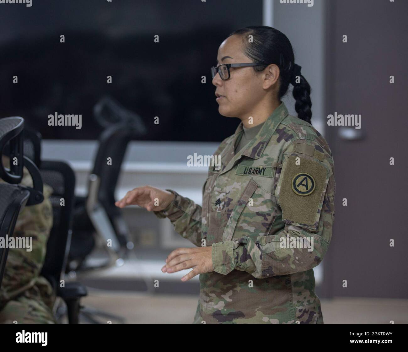 Army Sgt. Aleeya Vang, with Area Support Group - Kuwait provides instructions on the Noncombatant Evacuation Operations Tracking System at Camp Arifjan, Kuwait, July 1, 2021. The NTS provides accountability of evacuees by enabling operators to maintain a database of information for each evacuee as they enter, proceed through, and finally exit the evacuation process at a reception site or other exit point. Stock Photo