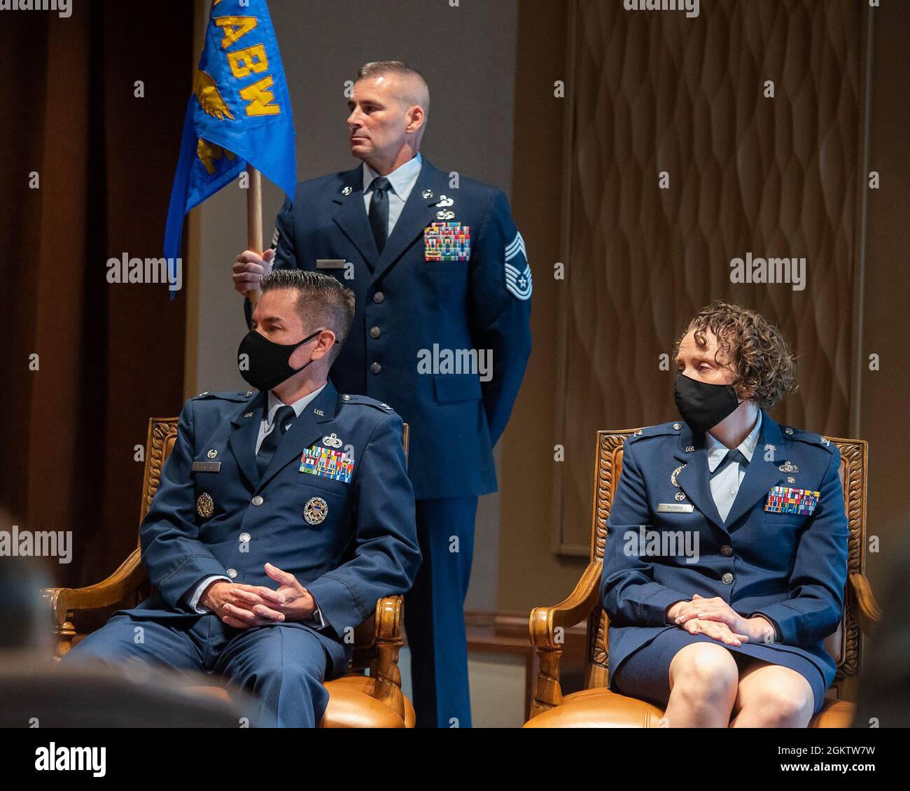Cols. Paul Burger and Sirena Morris listen as Col. Patrick Miller, 88th