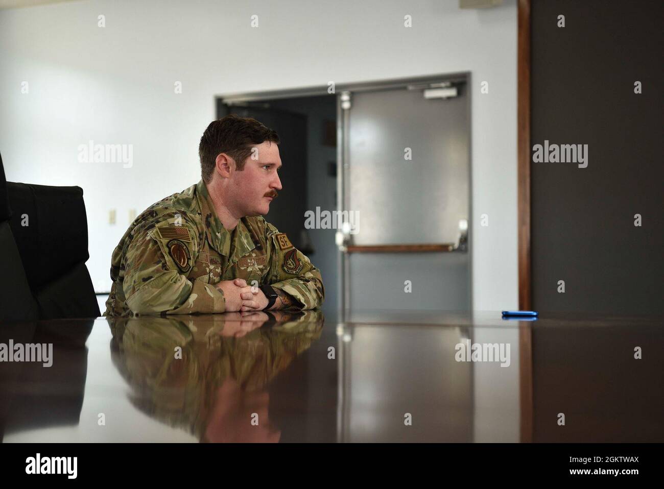 U.S. Air Force Staff Sgt. Nathaniel W. Stedman, 35th Security Forces Squadron base defense operations center controller/patrolman, gives an interview after being coined at Misawa Air Base, Japan, July 1, 2021. Stedman received a coin from Col. Jesse J. Friedel, 35th Fighter Wing commander, for saving a little girl from the water at the base’s beach. Stock Photo
