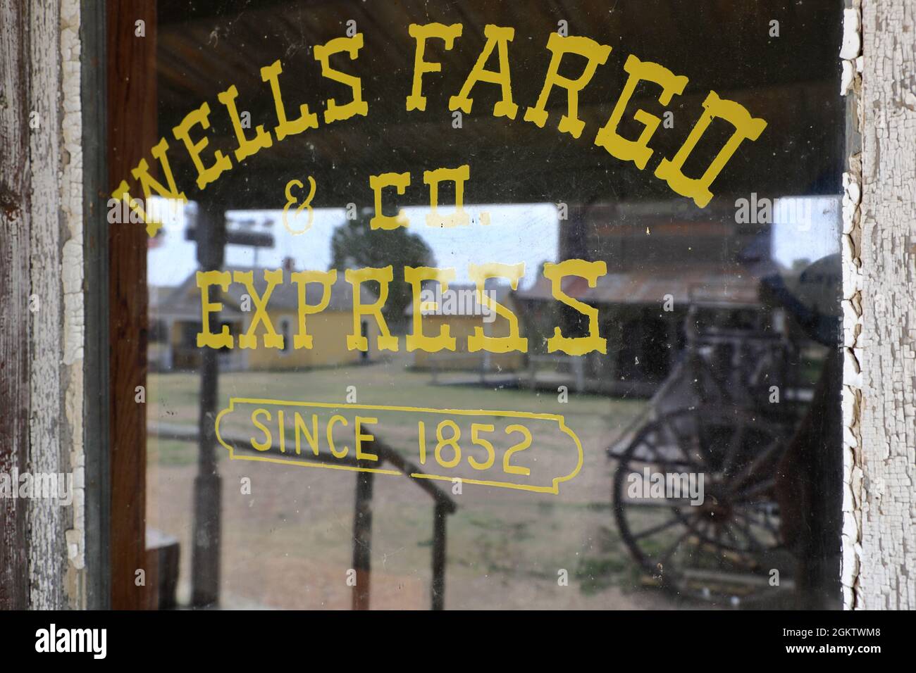 Glass window with the sign of Wells Fargo & Co.Express since 1852. 1880
