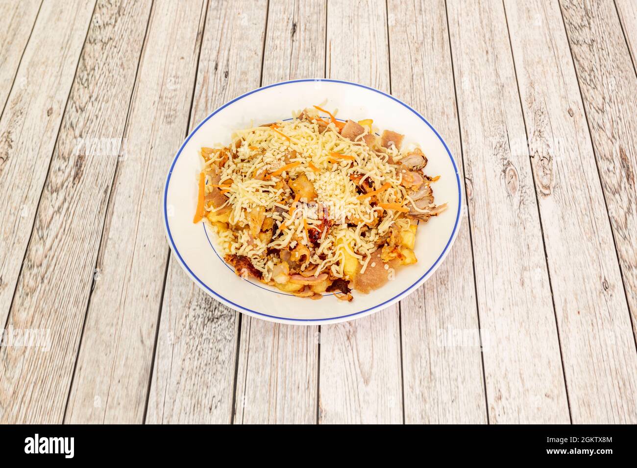 Mixed kebab scrambled eggs with potatoes and lamb with grated cheese Stock Photo