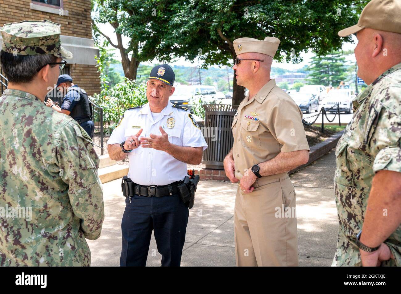 WASHINGTON, DC (July 1, 2021) – Col. Will Irizarry (center-left), Naval Support Activity Washington chief of police, speaks to command leadership onboard Washington Navy Yard. Stock Photo