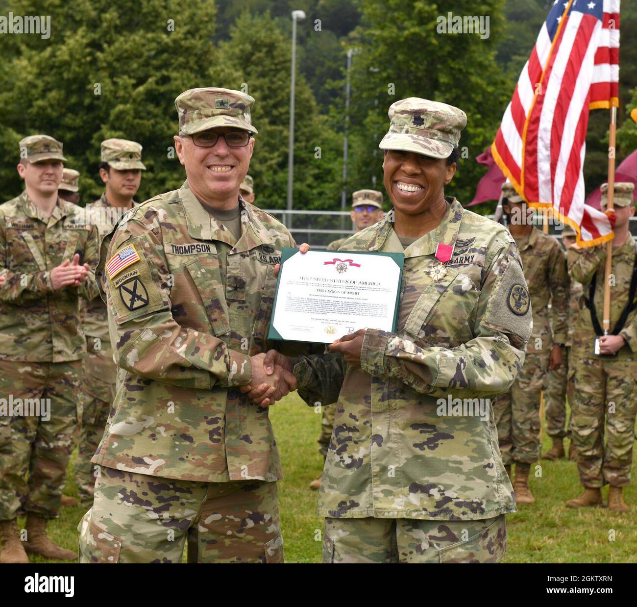 U.S. Army Brig. Gen. Mark Thompson, Regional Health Command Europe Commanding General and U.S. Army Europe and Africa Command Surgeon and Lt. Col. Christina M. Buchner, Landstuhl Regional Medical Center’s outgoing Troop Commander smile for the camera before a change of command ceremony at Landstuhl, Germany, July 1, 2021. Lt. Col. Casey Wilson assumed command of the unit from Buchner. Stock Photo