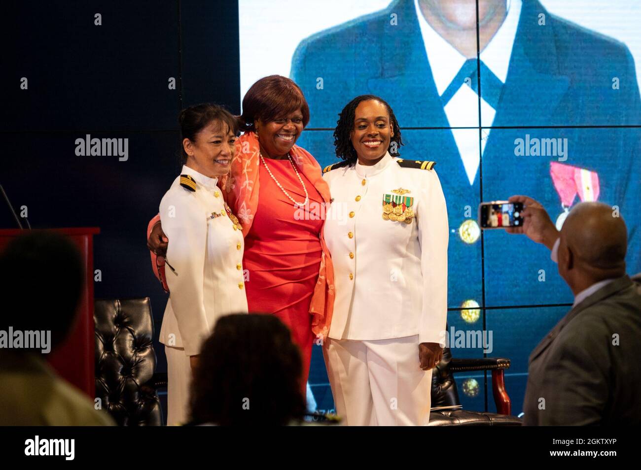 WASHINGTON, DC (July 1, 2021) – Lt. Takana Jefferson (right), Naval Support Activity Washington chaplain, poses with colleagues and friends prior to her promotion ceremony, held onboard Washington Navy Yard. Stock Photo