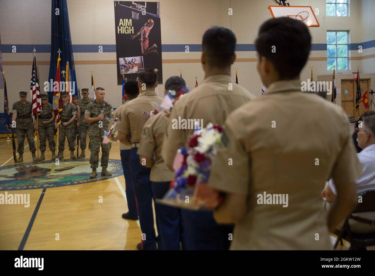 U.S. Marine Corps Col. Corey M. Collier, the outgoing Commanding Officer of  Marine Corps Security Force Regiment addresses Marines and family during a  change of command ceremony at the Sports Zone Gym,