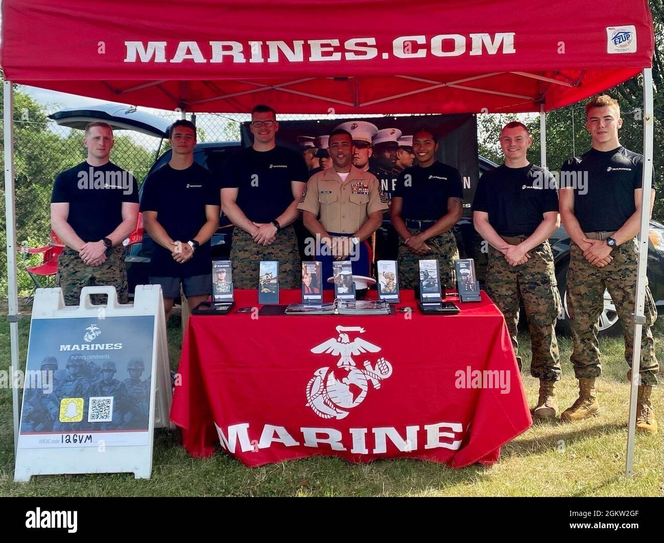 U.S. Marines from Recruiting Station Frederick, set up a table display at the Darn Good Country Weekend concert in Centreville, Virginia July 3, 2021. The Marines attended this event to speak with young men and women about enlistment in the U.S. Marine Corps. Stock Photo