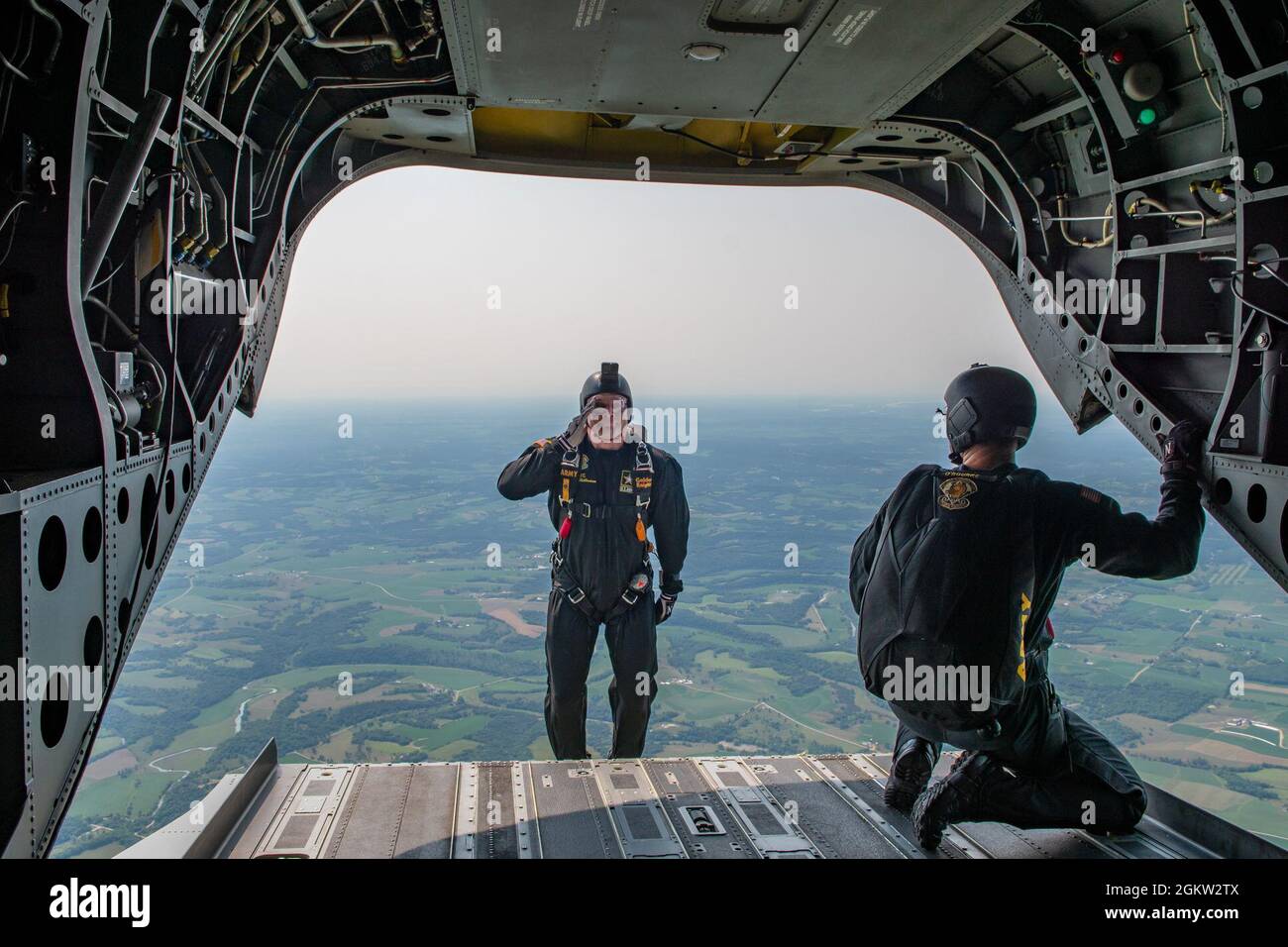 Sgt. 1st Class Danny Hellmann, member of the U.S. Army Parachute Team, jumps from a CH-47 Chinook helicopter over Hazel Green, Illinois, July 3, 2021. The U.S. Army Parachute Team performs aerial demonstrations in support of recruiting. Stock Photo