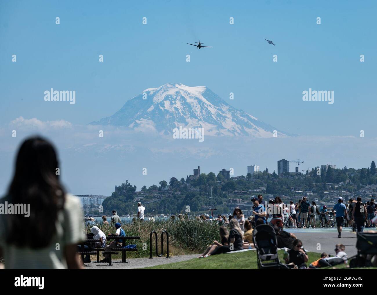 residents look on as a P40 Warhawk flies for the Freedom