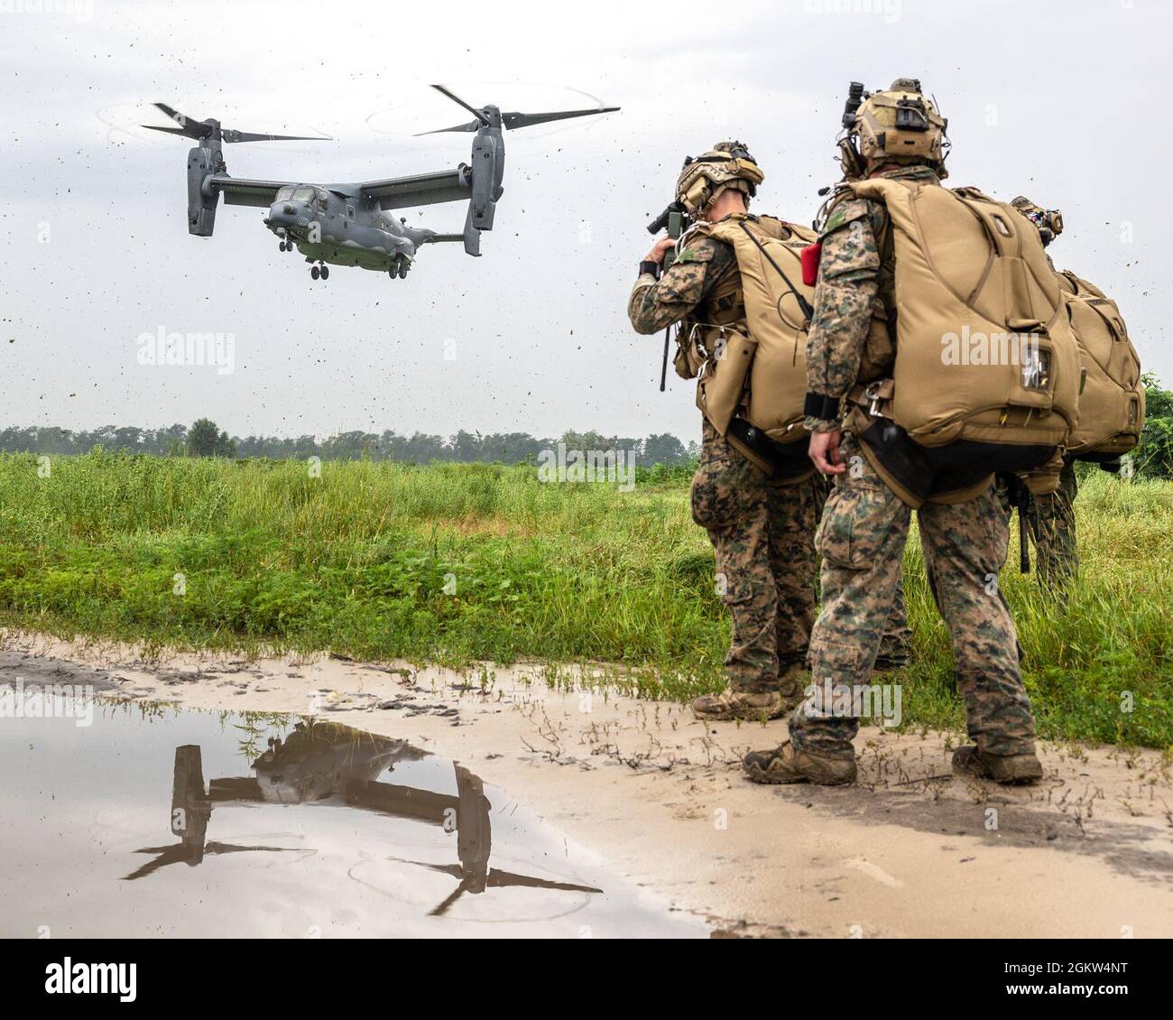 Marines assigned to Force Company 2D Reconnaissance Battalion, 2nd Marine Expeditionary Force prepare for a military free fall from a CV-22 Osprey assigned to the 352nd Special Operations Wing during exercise Sea Breeze 21 in Ochakiv, Ukraine, July 4, 2021. Exercise Sea Breeze 21 is a U.S. and Ukraine co-hosted multinational maritime exercise held in the Black Sea designed to enhance interoperability of participating nations and strengthen maritime security within the region. Stock Photo